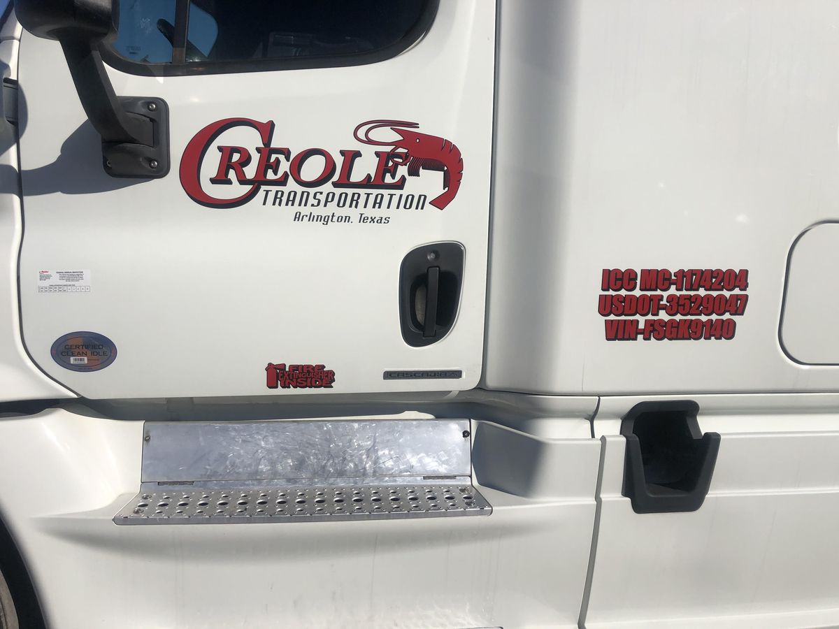 Creole Transportation truck door with credentials — ICC MC-1174204, USDOT-3529047